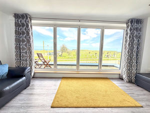 Bi-fold doors to balcony from living room- click for photo gallery